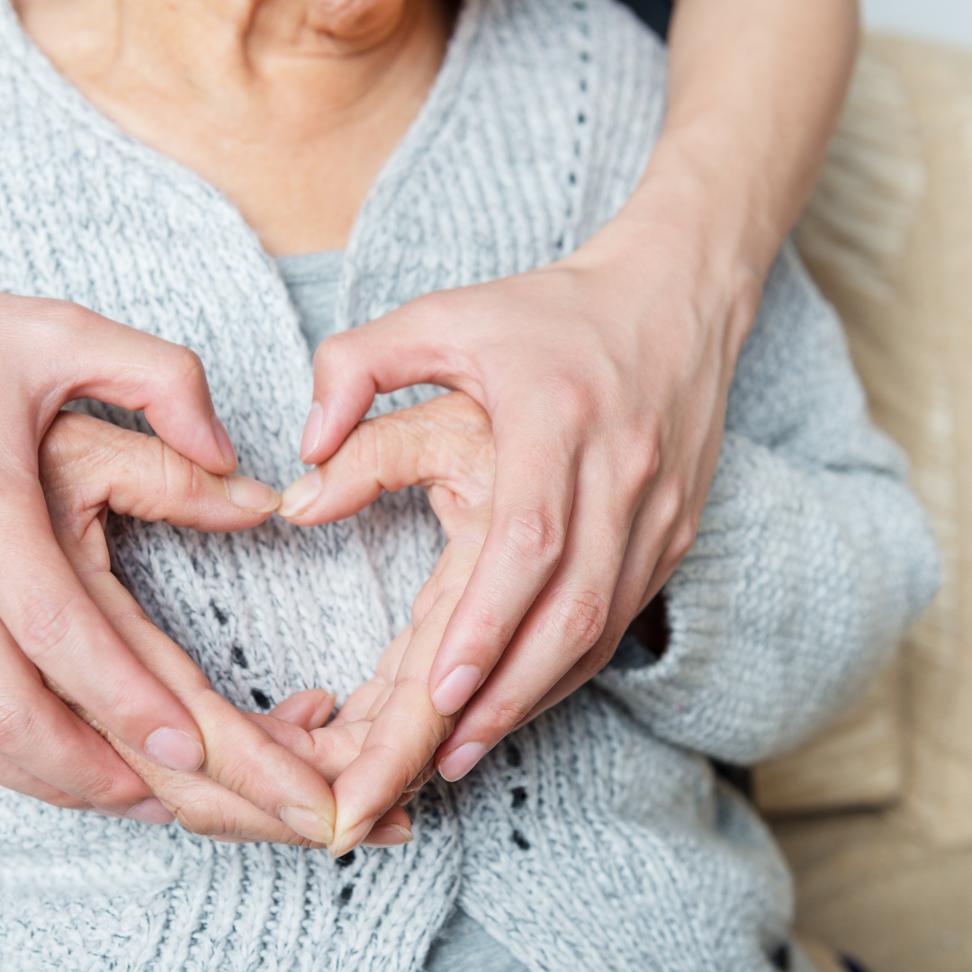 two hands making the shape of a heart